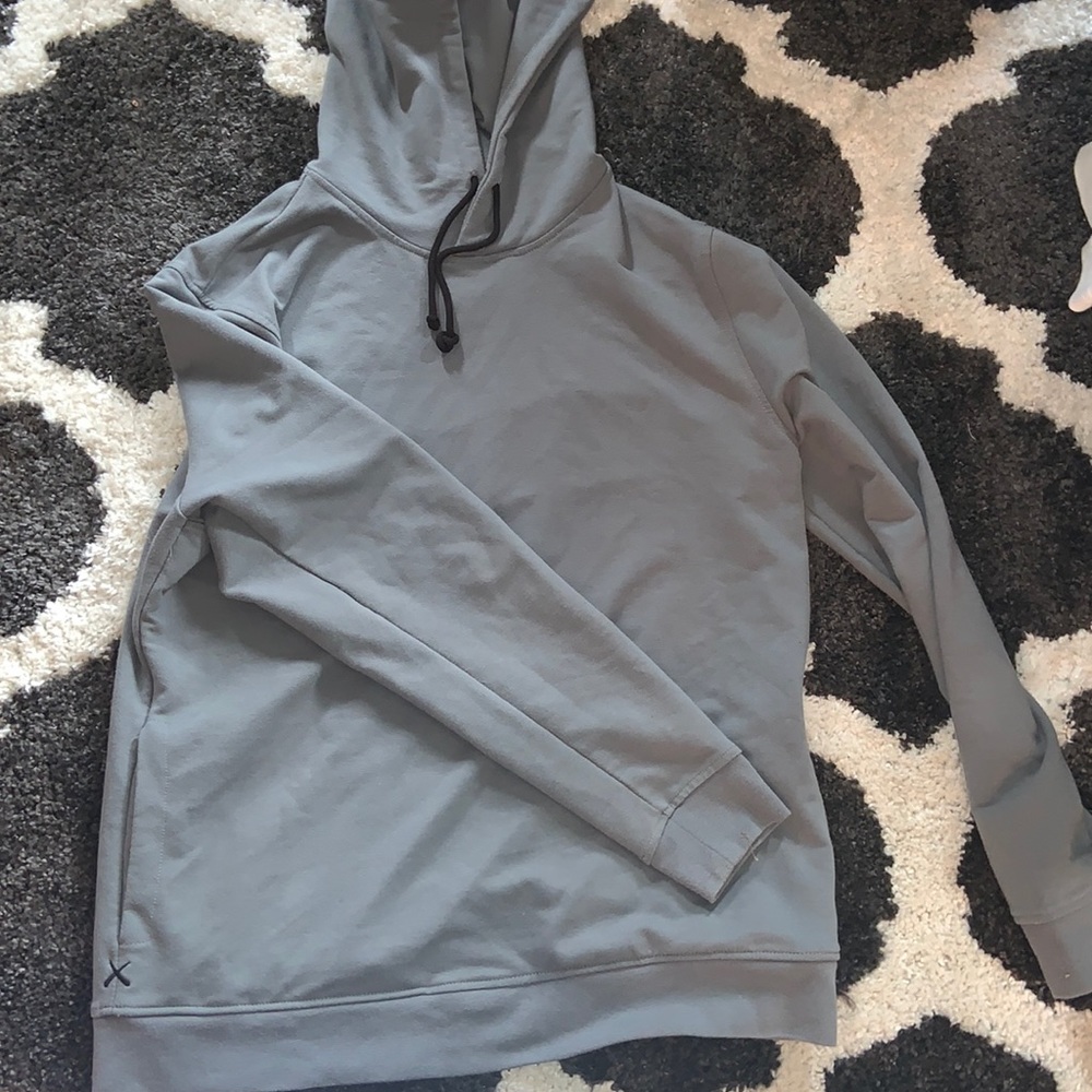 COPY - men’s grey-blue lightweight hoodie. Size is unknown but appears to be a …